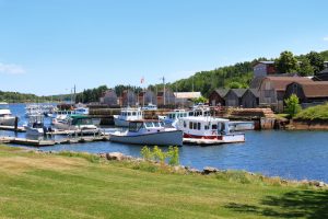 Harbour at Montague, Prince Edward Island, Canada with fishing boats, lobster traps and shacks along the pier