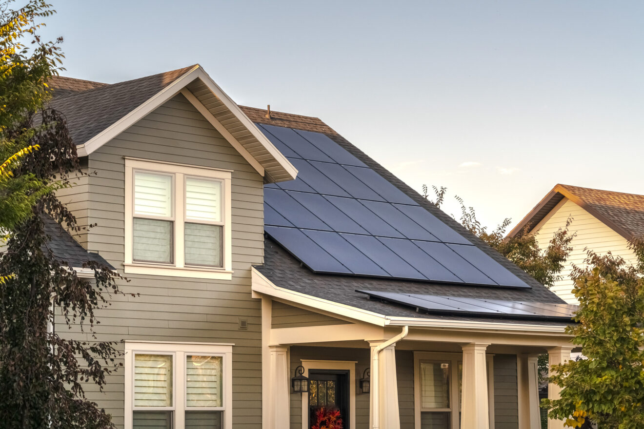 Solar photovoltaic panels on a house roof. Solar photovoltaic panels on a house roof for providing sustainable alternative energy from natural resources