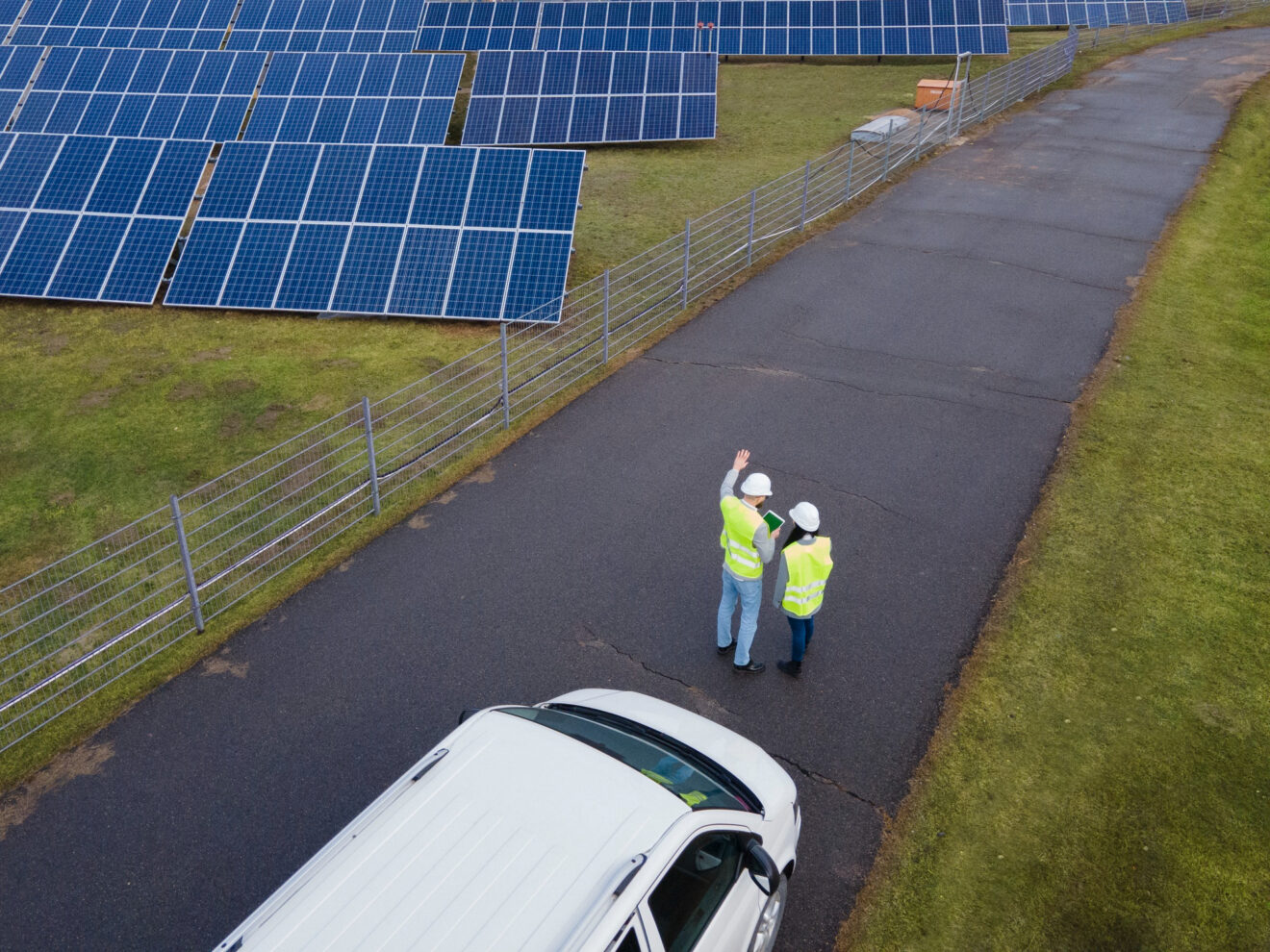 Environmental engineers talking at a solar farm