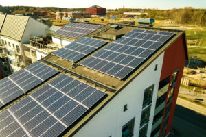 Aerial view of solar photovoltaic panels on a roof top of residential building